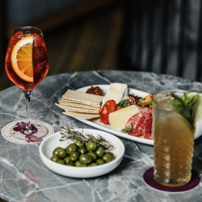 A Table With Food And Drinks On It