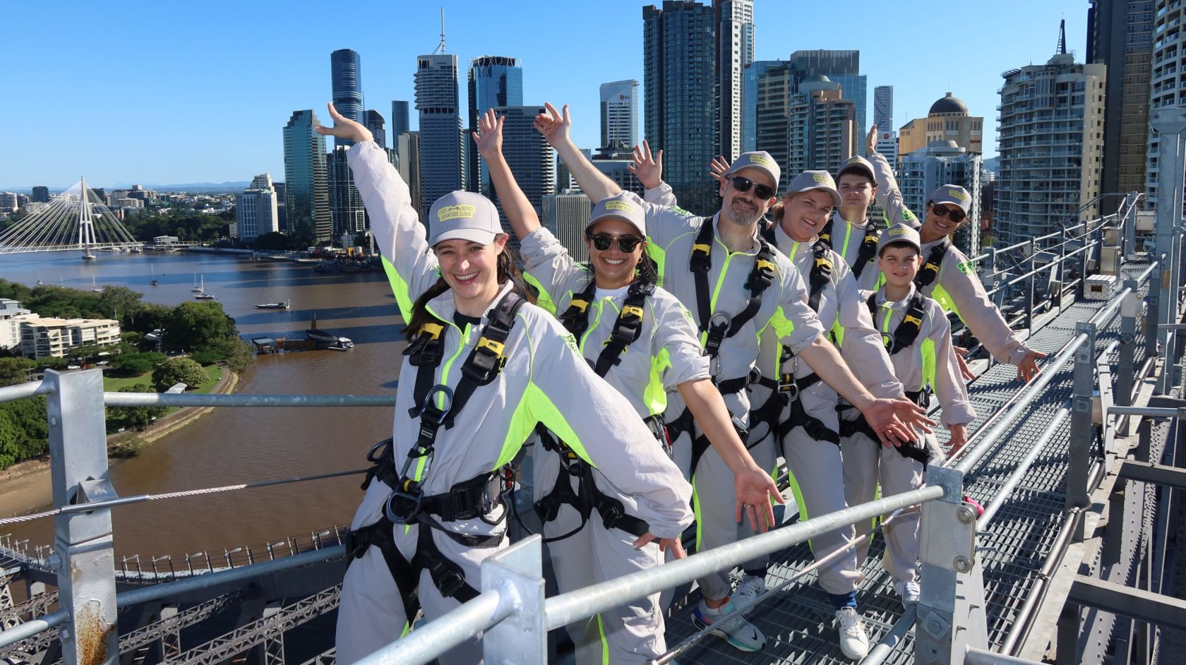 A Group Of People Posing For A Photo On A Bridge